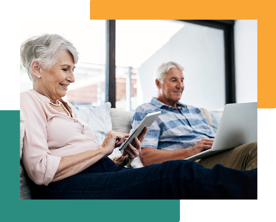 Two people on a couch using devices.