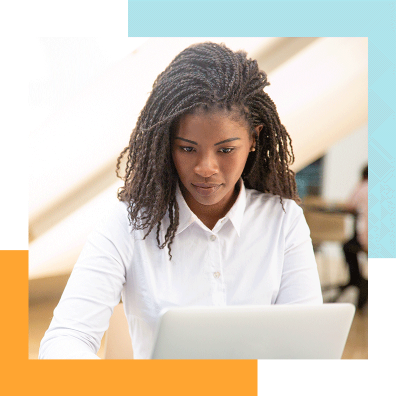 A woman looking at her laptop.