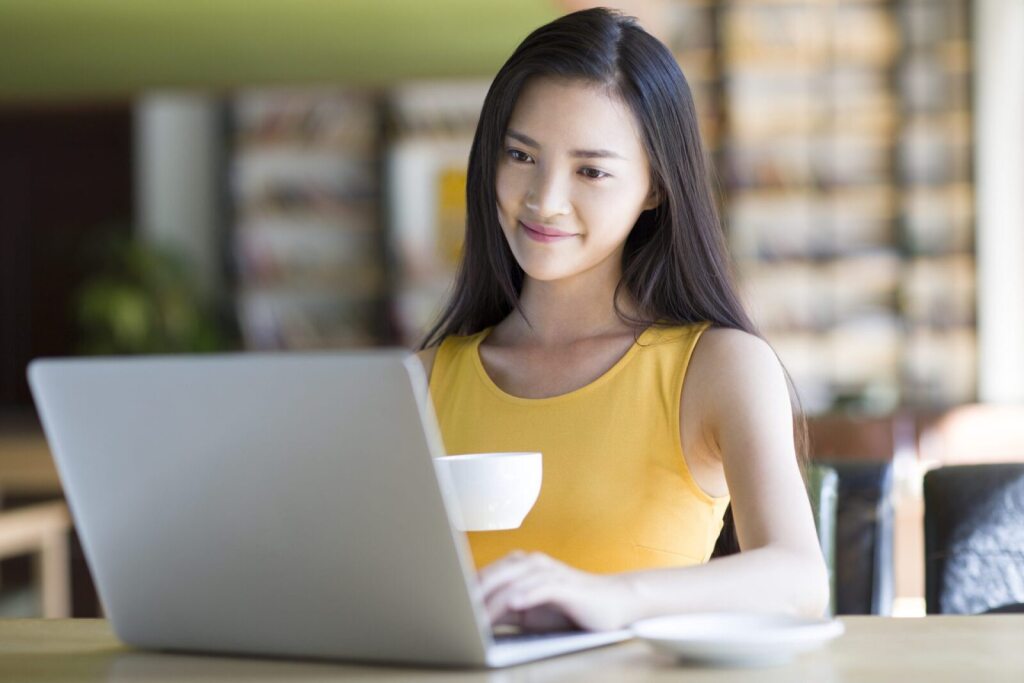 Woman on a laptop.