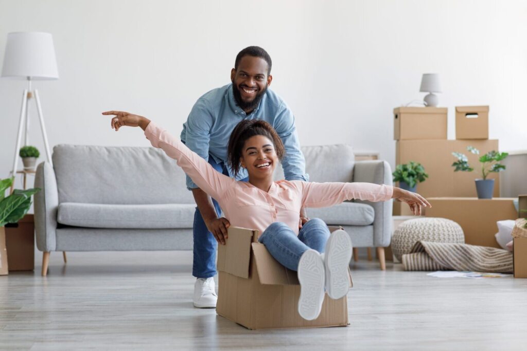 woman in moving box being pushed